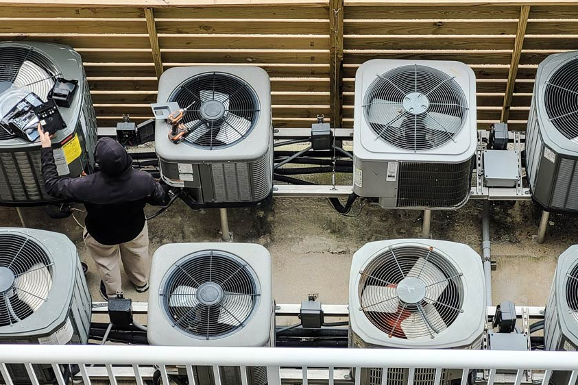 air conditioners being fixed by an hvac technician