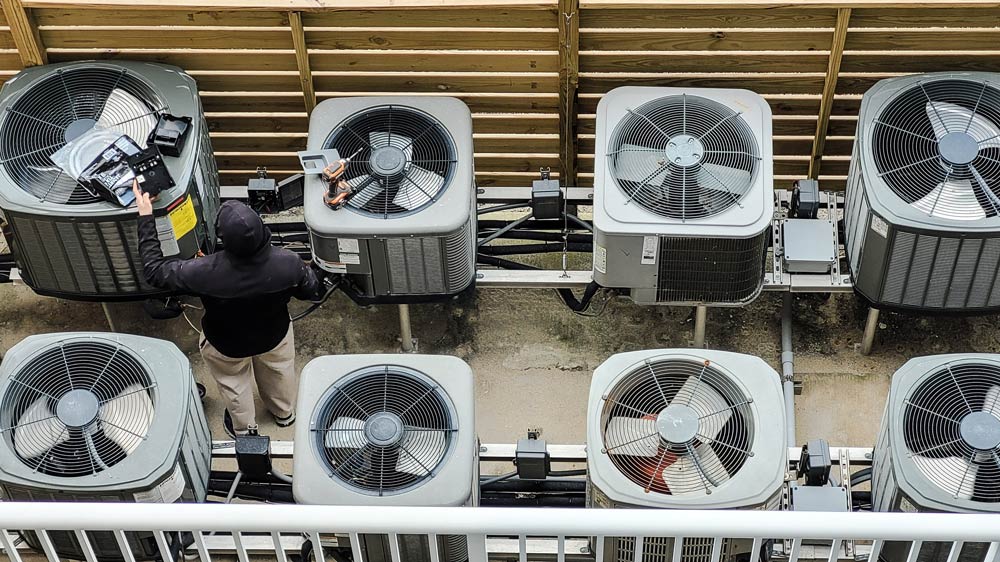 air conditioners being fixed by an hvac technician